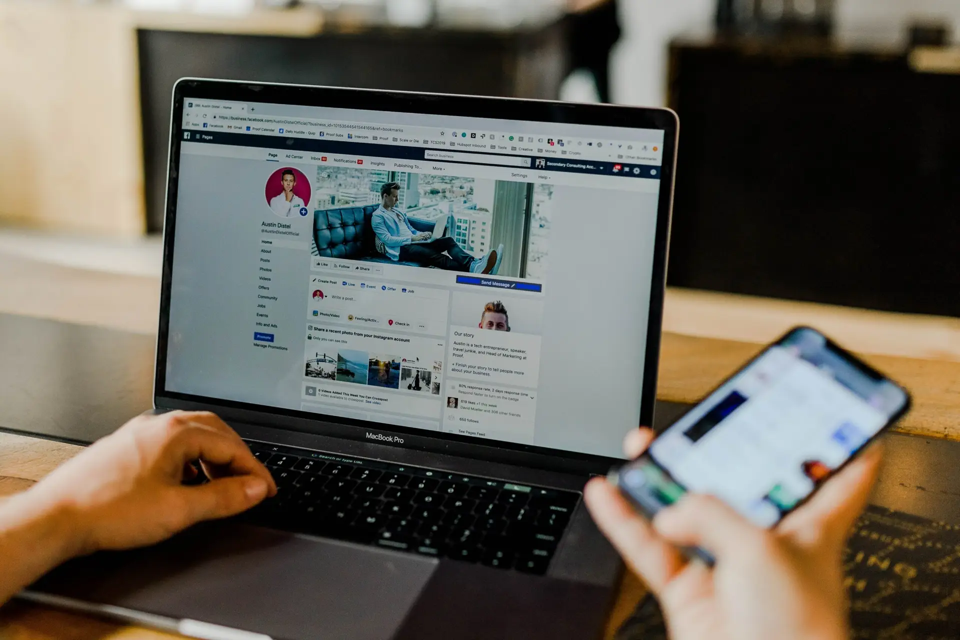 Person looking at Facebook on a laptop and smartphone representing Soulheart's article on nonprofit advertising.