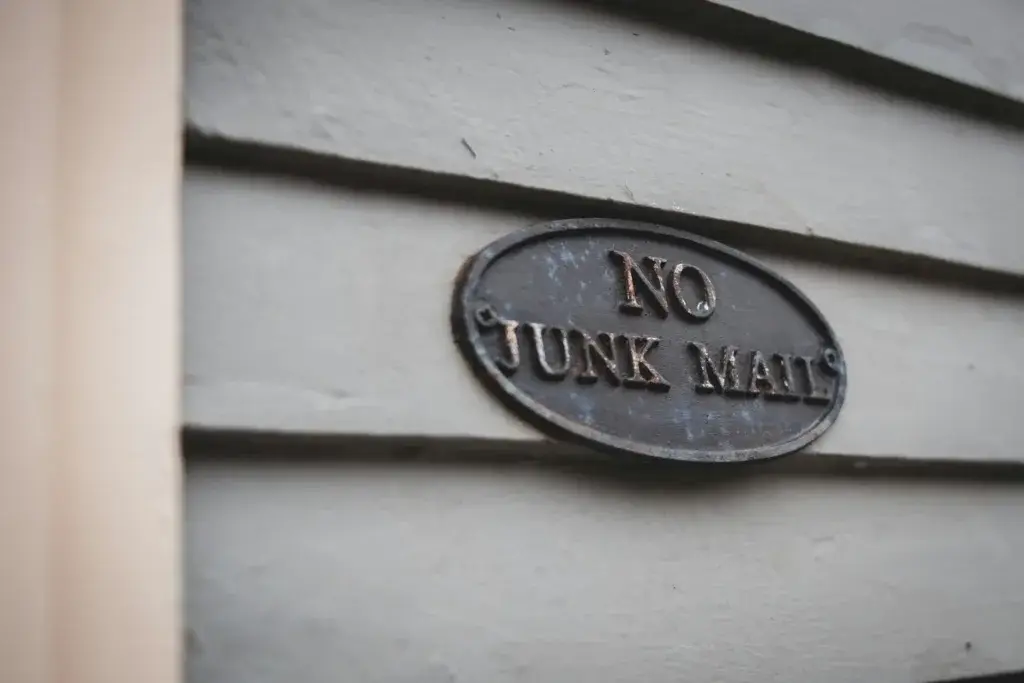 An image of a sign that reads "no junk mail" representing Soulheart's blog titled Google's DMARC Update [Business Email Deliverability Impact]