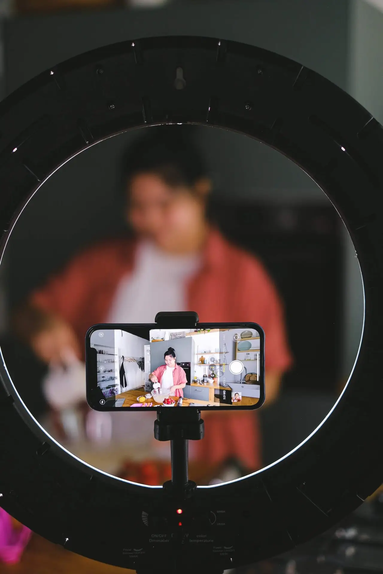 An image of a person filming herself representing Soulheart's blog A Guide for Creating Effective YouTube Videos.