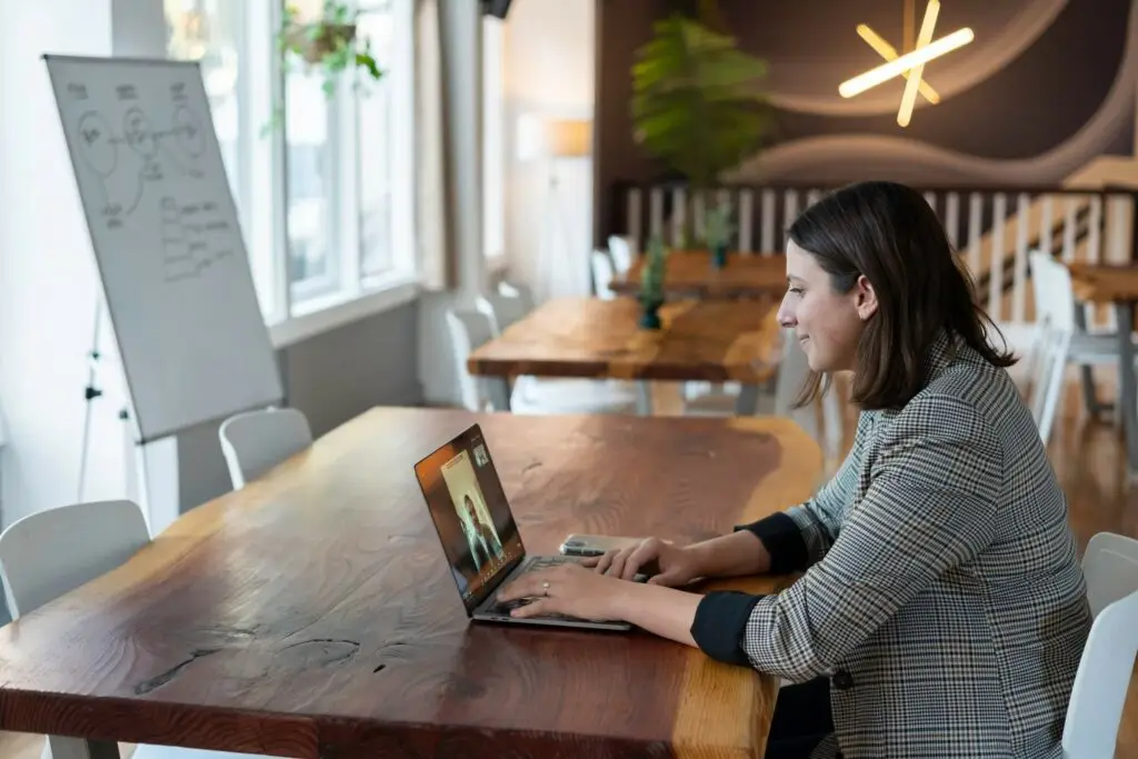 An image of a business woman having a video meeting representing Soulheart's blog titled A Nonprofit's Comprehensive Guide on Google Ads.