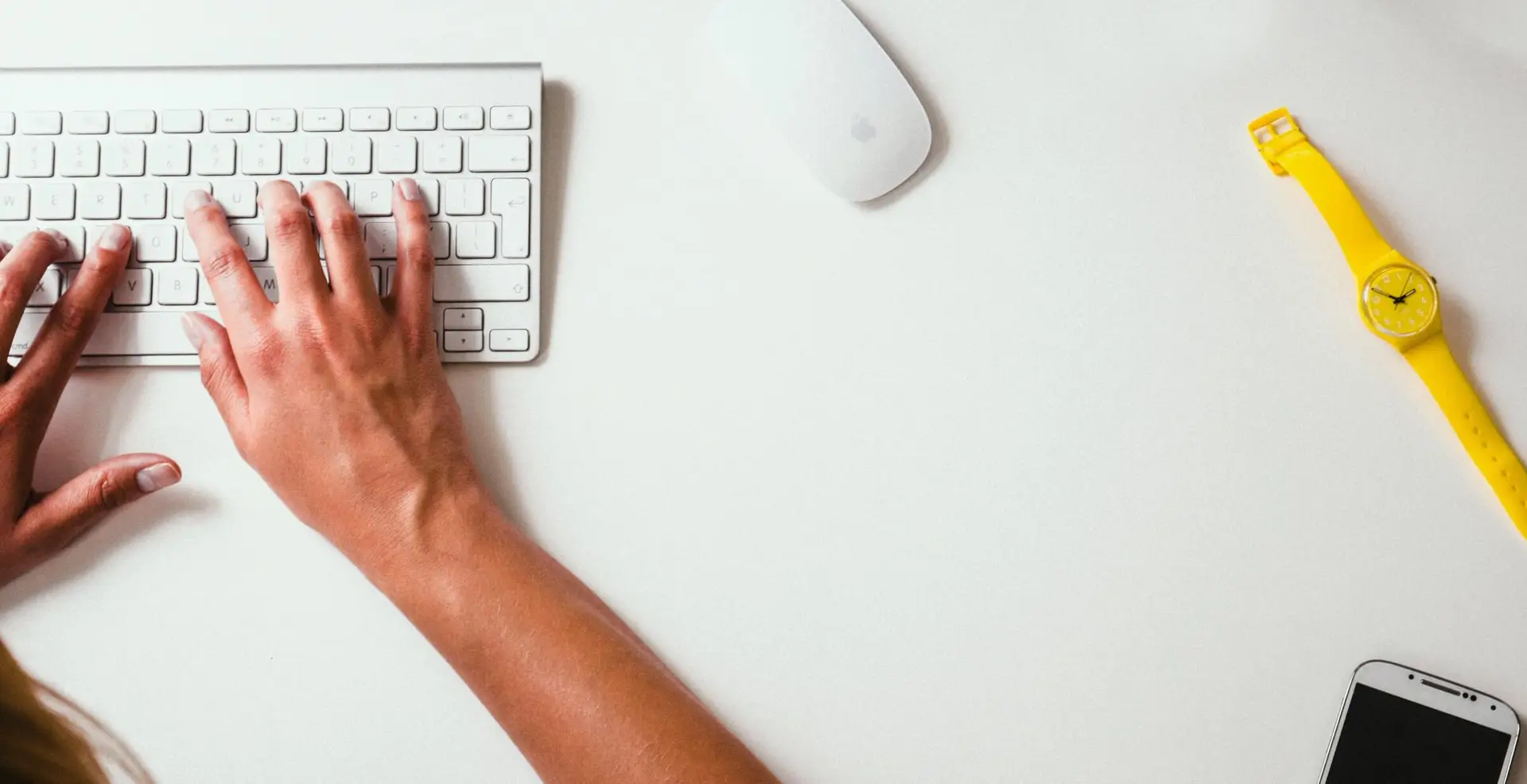 Image of a woman typing on a keyboard representing Soulheart's blog titled How Can Nonprofit Organizations Apply for Google Ad Grants