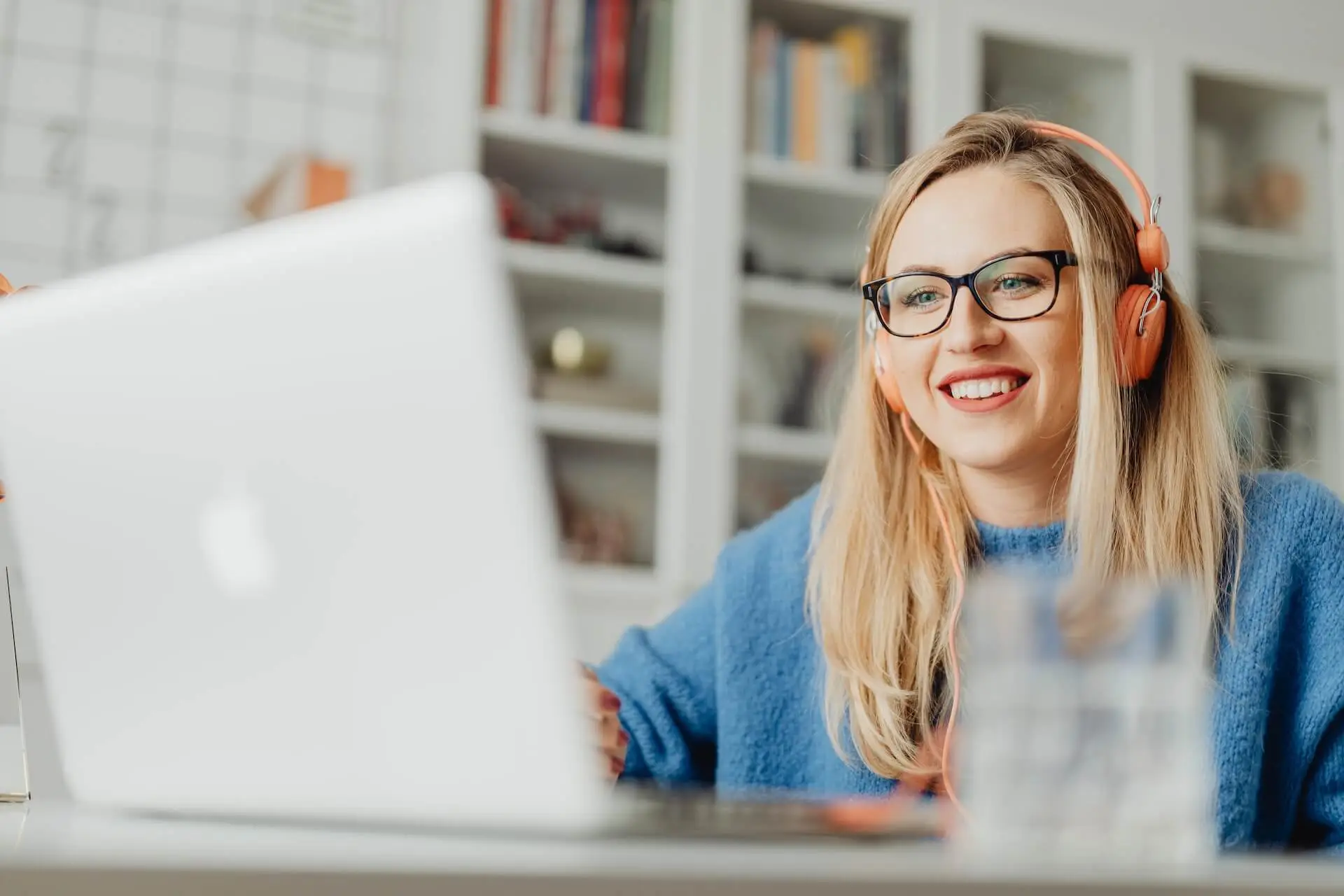 An image of a woman in front of her laptop representing Soulheart's blog titled YouTube Bumper Ads: Captivating Audiences in a Snap.