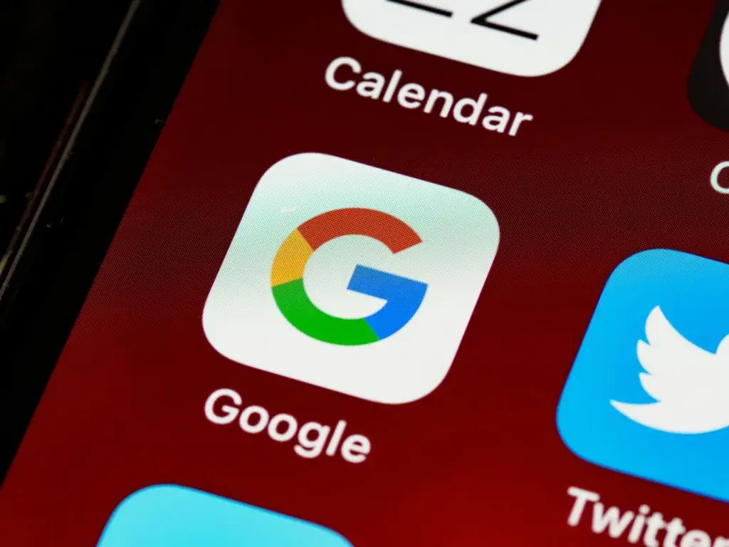 An image of Google's app icon on a smartphone representing Soulheart's blog titled Ranking #1 on Google for a High Volume Keyword in 1 Month
