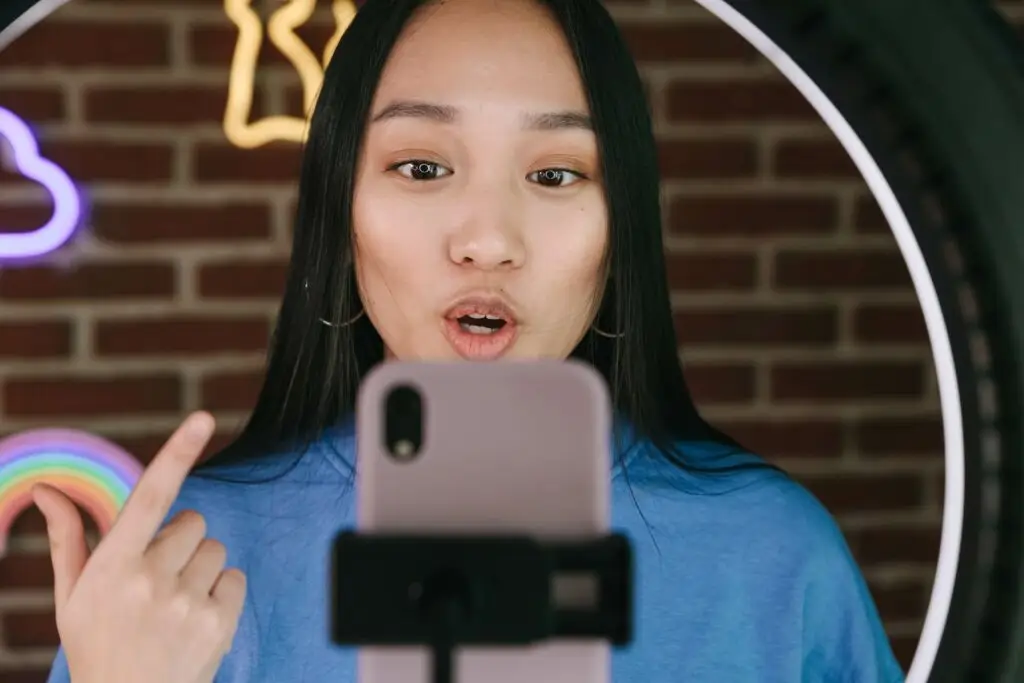 An image of a social media influencer recording a video representing Soulheart's blog titled Digital Marketing Trends Nonprofit Organizations Need to Know.