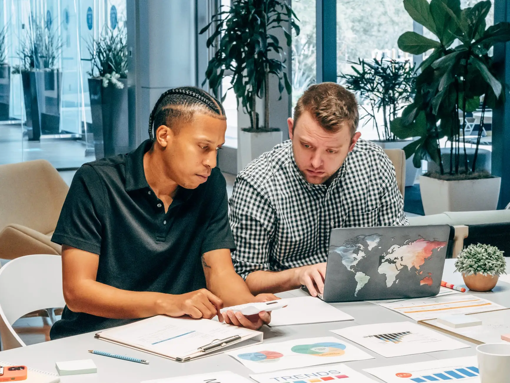 Two men working on an email automation plan.