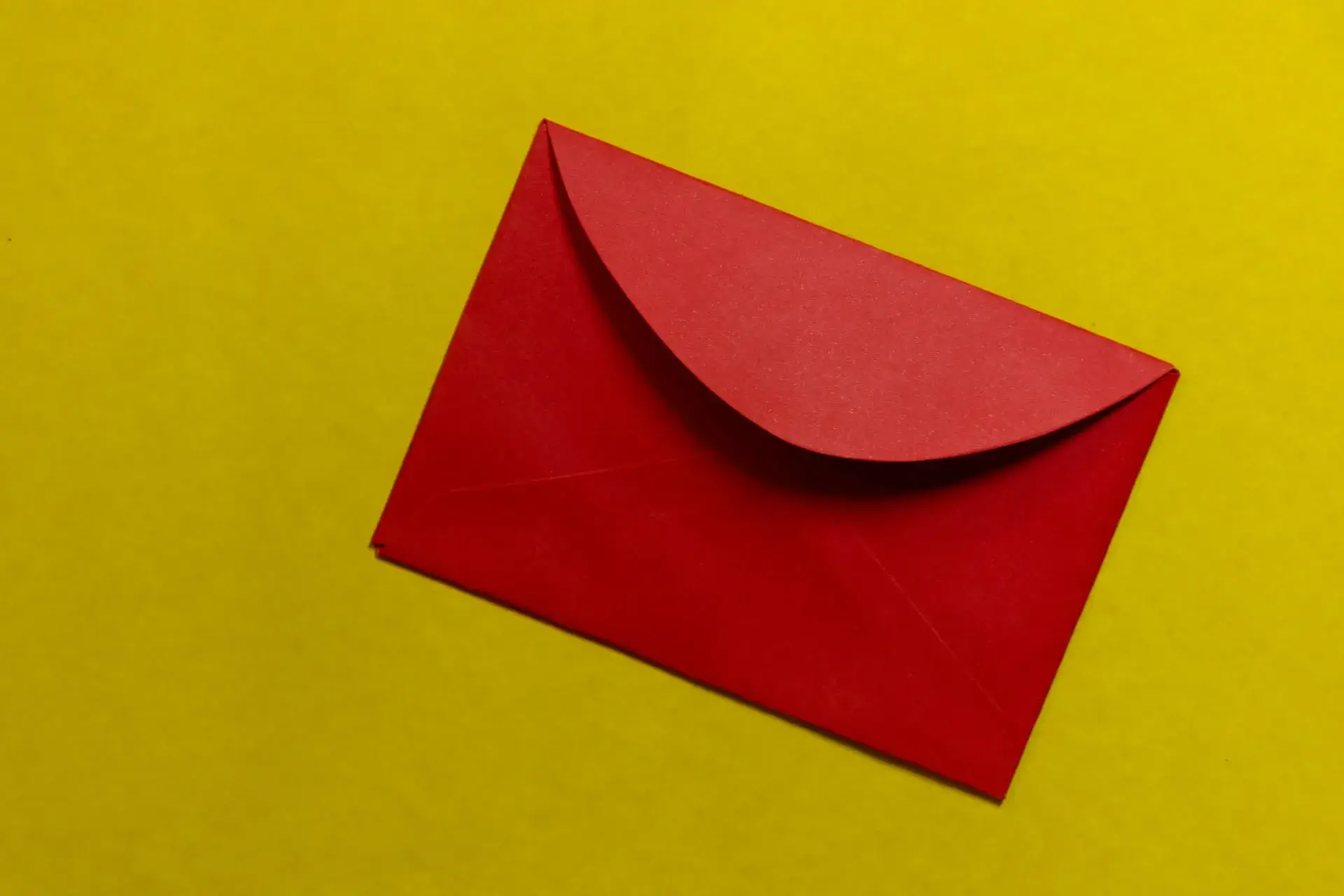 An image of a red envelope against a yellow background representing Soulheart's blog titled Google's DMARC Update [Business Email Deliverability Impact]|An image of a Gmail account on a laptop screen representing Soulheart's blog titled Google's DMARC Update [Business Email Deliverability Impact]|An image of a laptop with Gmail loading representing Soulheart's blog titled Google's DMARC Update [Business Email Deliverability Impact]|An image of a sign that reads "no junk mail" representing Soulheart's blog titled Google's DMARC Update [Business Email Deliverability Impact]