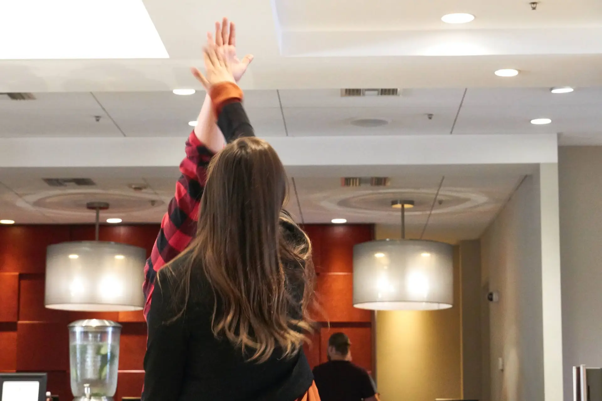 An image of two people high fiving representing Soulheart's blog titled Crack The Code How To Succeed On YouTube [Strategy Guide].
