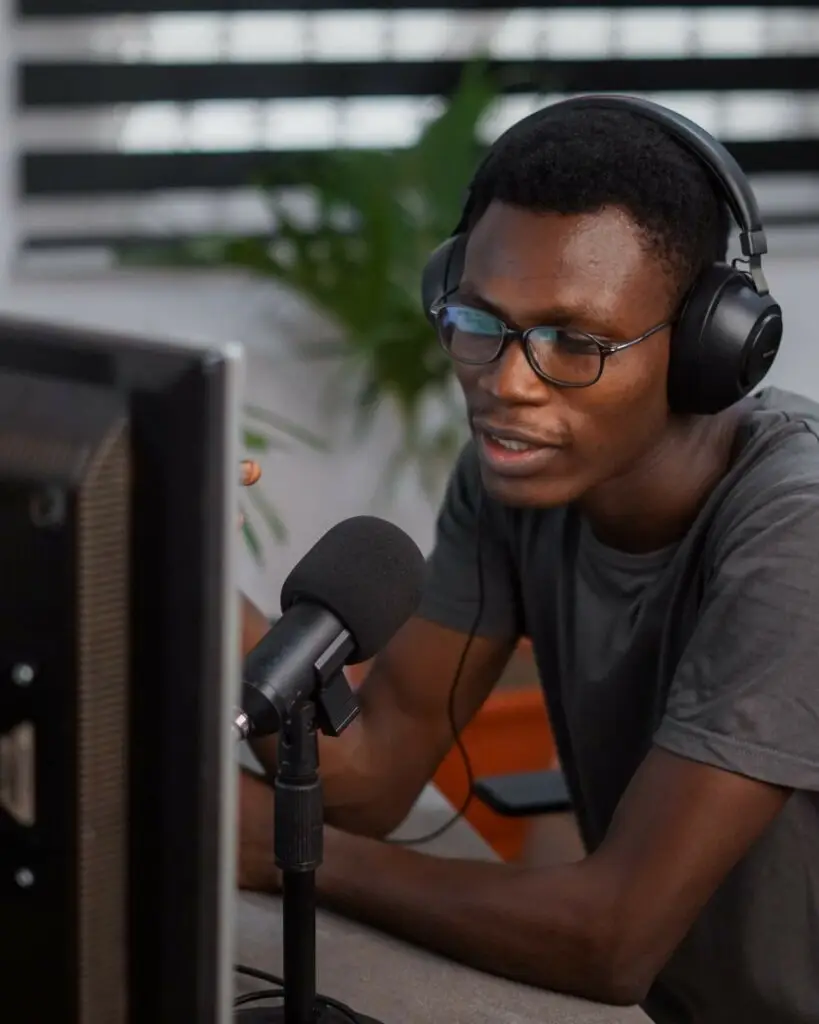 An image of a man speaking into a podcast microphone representing Soulheart's blog titled Digital Marketing Trends Nonprofit Organizations Need to Know.