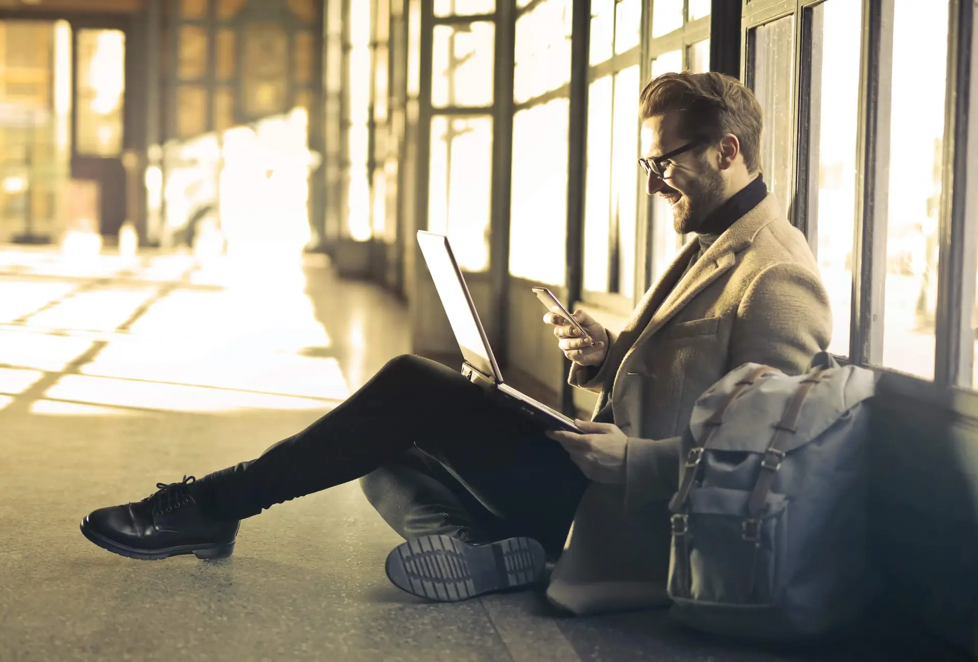 Image of business man on his laptop representing Soulheart's blog How the HubSpot Community Can Help Your Business Thrive