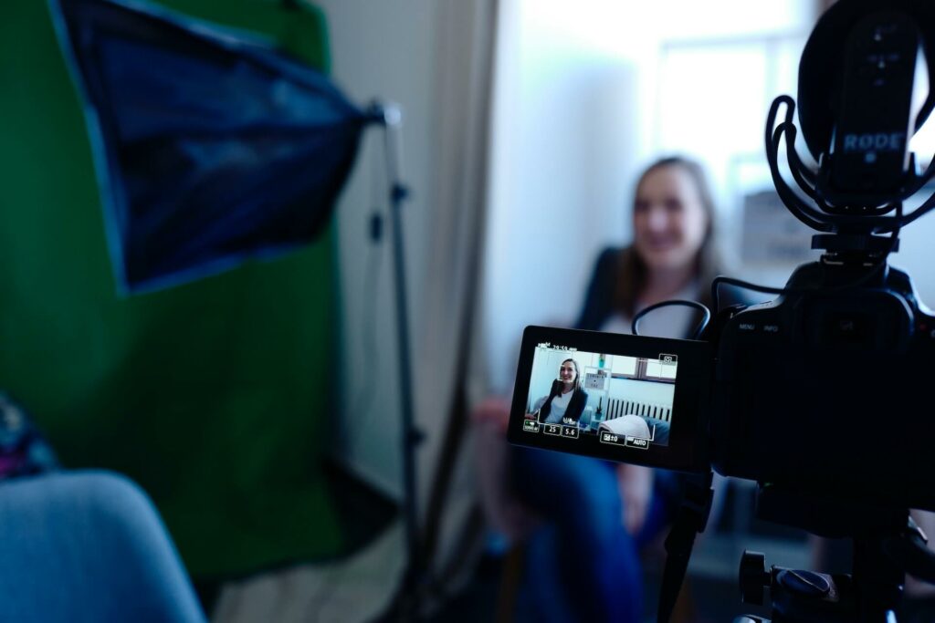 An image of a woman being filmed for a professional video representing Soulheart's blog titled Digital Marketing Trends Nonprofit Organizations Need to Know. 